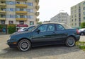 Old dark green Volkswagen Golf II convertible parked