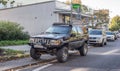 Old but elegant Jeep Grand Cherokee high suspension parked