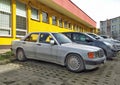 White veteran vintage classic old white sedan car Mercedes Benz 190E parked