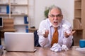 Old male employee in paper recycling concept Royalty Free Stock Photo