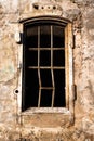 Old empty barred window in the house Royalty Free Stock Photo