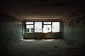 Old empty dirty grunge room with big windows in abandoned house or building inside Royalty Free Stock Photo