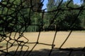 Old empty football field with iron gate