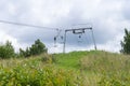 Old empty ski lift in summer landscape Royalty Free Stock Photo
