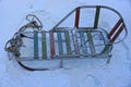 Old empty sledges in a snowdrift on the street