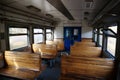 Old empty wagon of train. Wooden seats in an empty coach of train Royalty Free Stock Photo