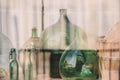 Old empty wine bottles behind the glass Royalty Free Stock Photo