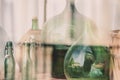 Old empty wine bottles behind the glass Royalty Free Stock Photo