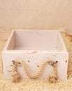 An old empty wooden box on  background of faux fur. Royalty Free Stock Photo