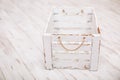 An old empty wooden box on old white background. Royalty Free Stock Photo