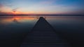 Old empty wooden jetty on lake. Royalty Free Stock Photo