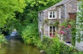 Old English cottage on river Royalty Free Stock Photo