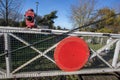 Old English level crossing with gates and red warning light Royalty Free Stock Photo