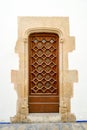 Old entrance door of an ancient building with a graceful pattern Royalty Free Stock Photo