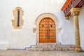 Old entrance door of an ancient building with a graceful pattern Royalty Free Stock Photo