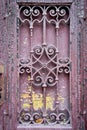 Old entrance doors of buildings with metal bars. Background for old architecture. The craftsmanship of a blacksmith Royalty Free Stock Photo