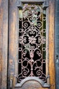 Old entrance doors of buildings with metal bars. Background for old architecture. The craftsmanship of a blacksmith Royalty Free Stock Photo