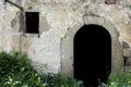 Old entrance stone door and small window in forest Royalty Free Stock Photo