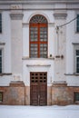 Old entrance to the building with a large window. Royalty Free Stock Photo