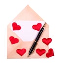 Old envelope with lots of different red hearts and black pen isolated on white background Royalty Free Stock Photo