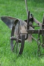 An old equestrian plow on green grass. The middle band of Russia.