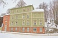 Old estonian house in a snow covered garden Royalty Free Stock Photo