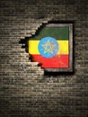 Old Ethiopia flag in brick wall Royalty Free Stock Photo