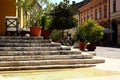 Old european city street corner. stone steps, fountain and patio terrace Royalty Free Stock Photo