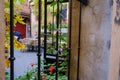 Old European courtyard with flowers and a table