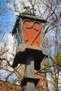 Old European lantern. Warsaw, Poland Famous old town capital city during sunny summer day background blue sky and closeup of sign Royalty Free Stock Photo