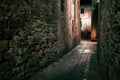 Old European narrow empty street of a medieval town at evening. Royalty Free Stock Photo