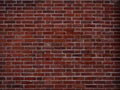 Old european red brick wall, abstract vintage grunge background texture Royalty Free Stock Photo