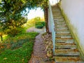 Home garden with stone steps full of autumn leaves Royalty Free Stock Photo