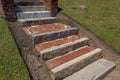 Old exterior steps and landings of rusticated stone, brick, and marble Royalty Free Stock Photo