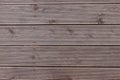 Old exterior wooden decking or flooring on the terrace.Background of a wenge-colored terrace Board with horizontal Royalty Free Stock Photo