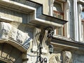 The old facade of the building wrought iron lantern over the entrance.