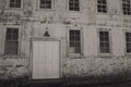 Old facade with lamp, door and windows