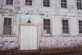 Old facade with lamp, door and windows