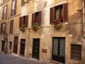 Old facades of an ancient street in the Monti district to Rome in Italy. Royalty Free Stock Photo