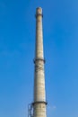 Old factory buildings and chimneys under blue sky