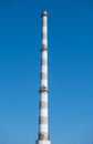 Old industrial plant chimney, sunny day, vertical photo Royalty Free Stock Photo