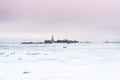 Old factory in the middle of the frozen sea