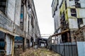 Old factory ruin and broken windows. Industrial building for demolition