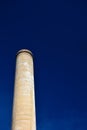 Old Factory Smokestack on a Clear Sunny Day with Blue Skies