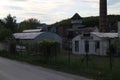 Old Factory with smokestack and tower in Majdan Male Karpaty mountains near Horne Oresany, west Slovakia Royalty Free Stock Photo