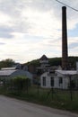 Old Factory with smokestack and tower in Majdan Male Karpaty mountains near Horne Oresany, west Slovakia Royalty Free Stock Photo