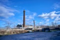 Old factory under the blue sky. Industrial building with chimney made of red brick Royalty Free Stock Photo