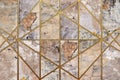 Old, faded and cracked wall collage with golden frames. Concrete, cement and golden wall pattern. Symmetric and abstract