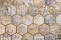 Old, faded and cracked wall collage with golden frames. Concrete, cement and golden wall pattern. Symmetric and hexagon