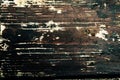 Old, faded, darkened by time, gray knotty horizontal wooden plank close-up